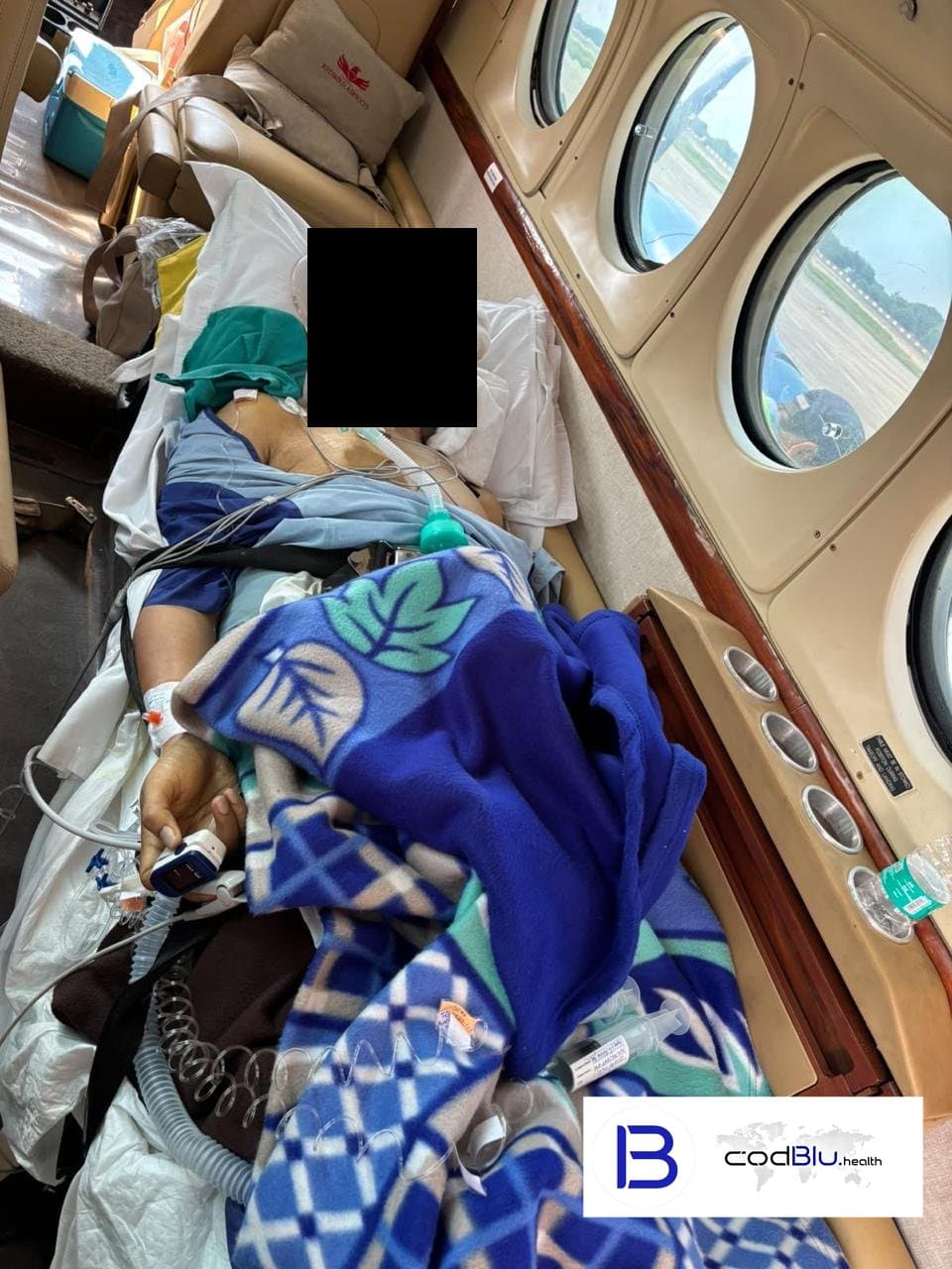 Intubated ventilator patient in a charter air ambulance cabin