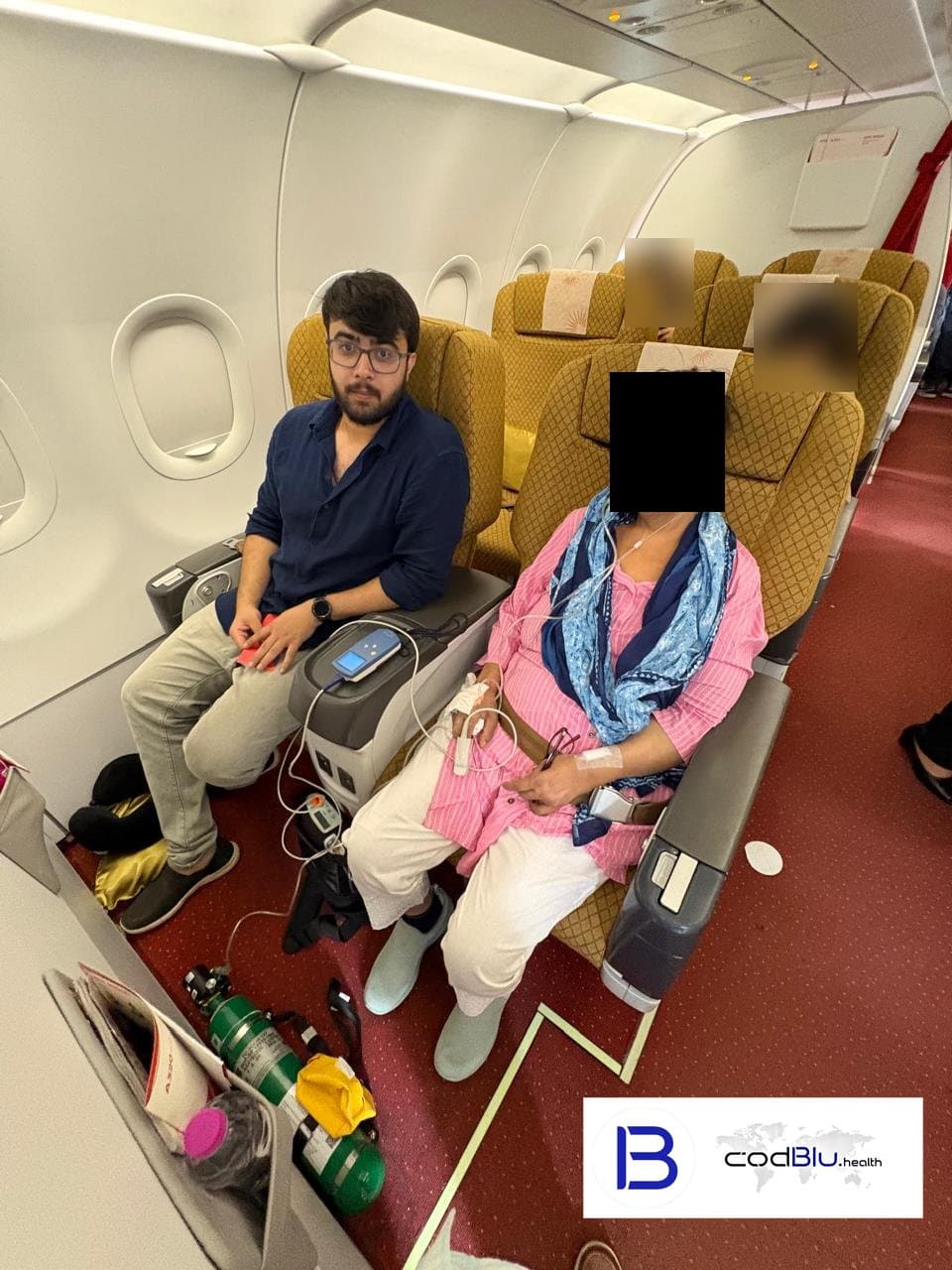 Doctor escorting a patient on oxygen on a commercial flight