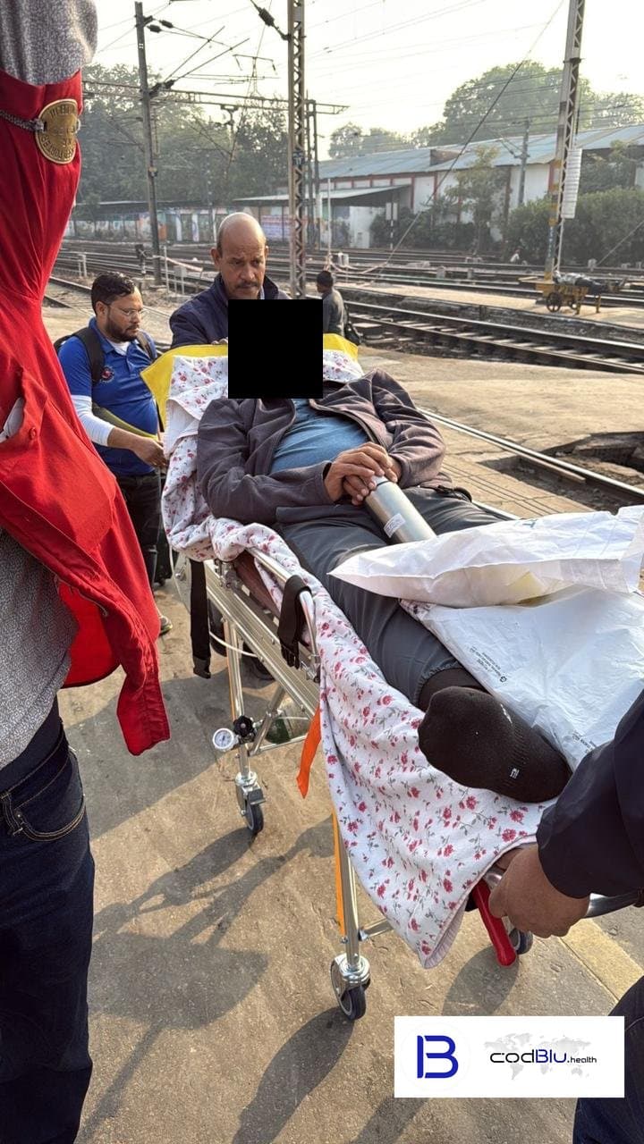 Patient moved by stretcher on a railway platform for a rail ambulance transfer